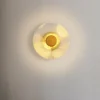 S0b37eb0b4c8a4ea3ac8f23408cbe932b9.webp Circular Acrylic Wall Sconce with Golden Leaf Decoration